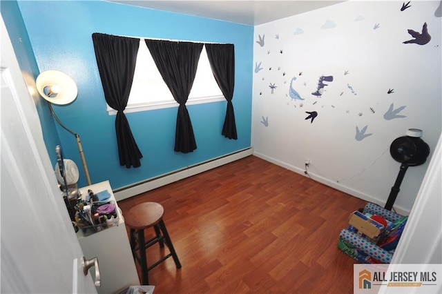 313 Demorest Ave, Avenel, NJ 07001 - interior space with a baseboard heating unit and wood finished floors