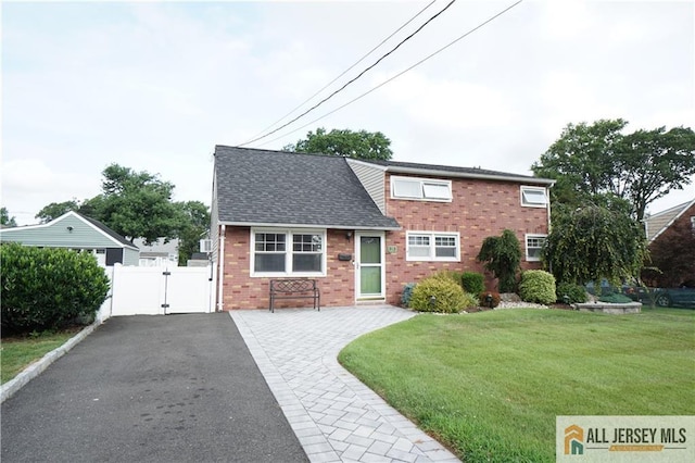 313 Demorest Ave, Avenel, NJ 07001 - view of front facade with a gate and brick siding