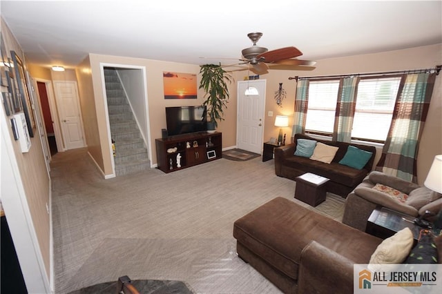 313 Demorest Ave, Avenel, NJ 07001 - carpeted living room featuring stairway and a ceiling fan