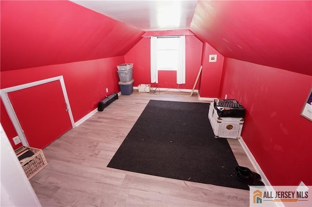 313 Demorest Ave, Avenel, NJ 07001 - additional living space featuring wood finished floors and vaulted ceiling