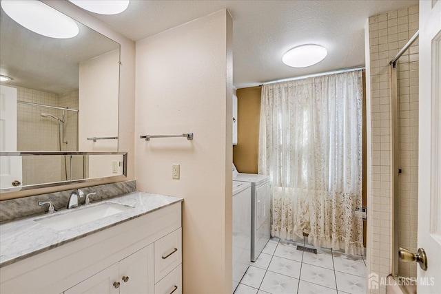 full bath featuring vanity, curtained shower, tile patterned floors, and independent washer and dryer