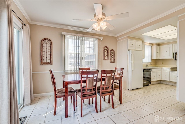 dining space with light tile patterned floors, ceiling fan, ornamental molding, and a wealth of natural light