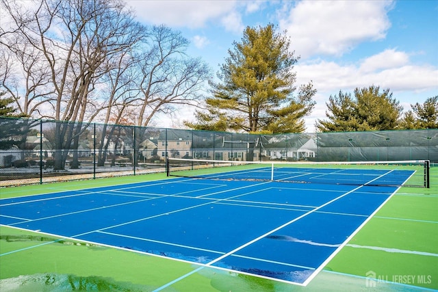 view of sport court featuring fence and community basketball court