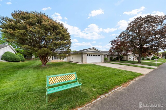 209-A Vernon Rd, Monroe, NJ 08831 - view of front of property featuring concrete driveway, a front lawn, and a garage