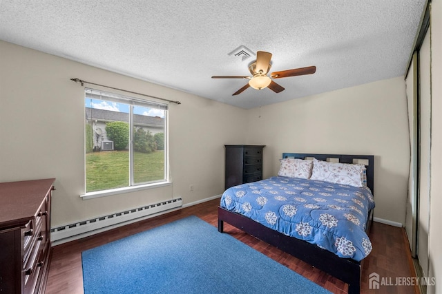 209-A Vernon Rd, Monroe, NJ 08831 - bedroom with a baseboard radiator, wood finished floors, a textured ceiling, a ceiling fan, and baseboards