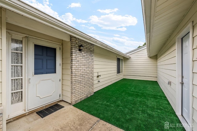 209-A Vernon Rd, Monroe, NJ 08831 - property entrance with brick siding and a yard