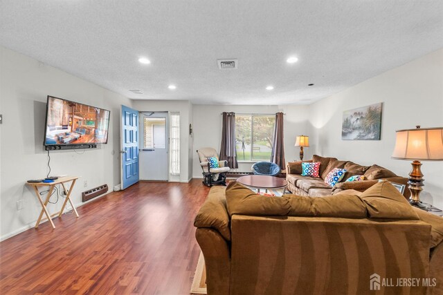 209-A Vernon Rd, Monroe, NJ 08831 - living area featuring dark wood finished floors, recessed lighting, a textured ceiling, and baseboards