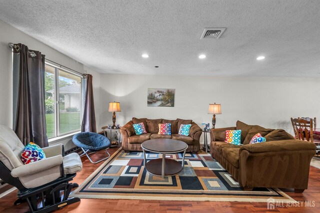 209-A Vernon Rd, Monroe, NJ 08831 - living area featuring a textured ceiling, recessed lighting, and wood finished floors