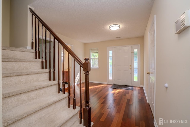 85 W Shrewsbury Pl, Princeton, NJ 08540 - entryway with dark wood finished floors, baseboards, stairs, and a textured ceiling