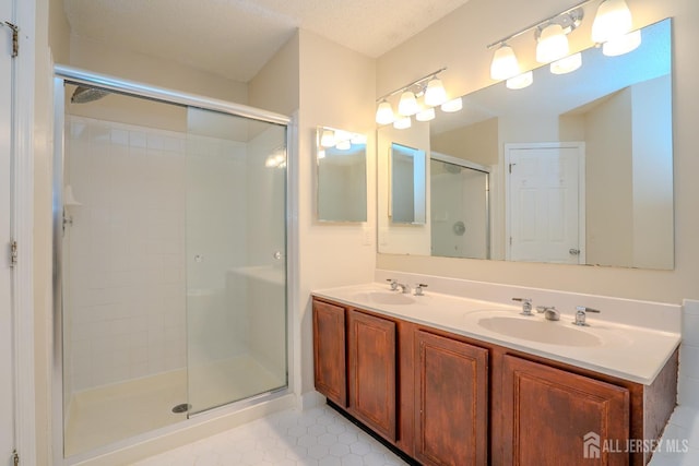 85 W Shrewsbury Pl, Princeton, NJ 08540 - full bathroom with a stall shower, double vanity, and tile patterned floors