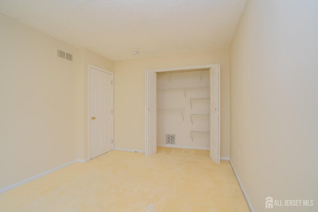 85 W Shrewsbury Pl, Princeton, NJ 08540 - unfurnished bedroom featuring baseboards, a closet, and light carpet