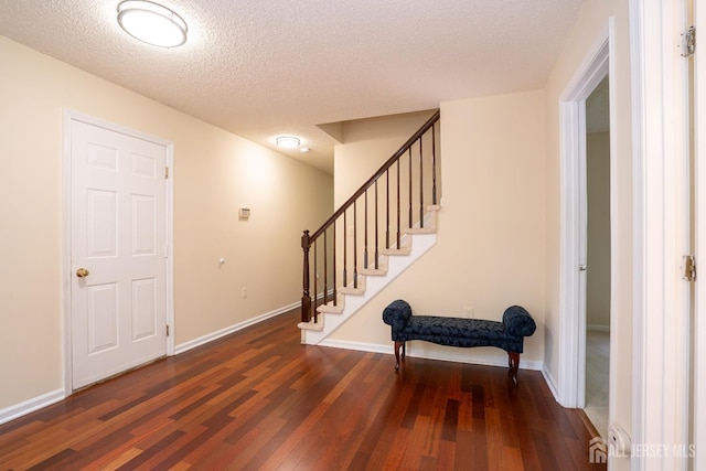 85 W Shrewsbury Pl, Princeton, NJ 08540 - entryway featuring wood finished floors, stairway, a textured ceiling, and baseboards