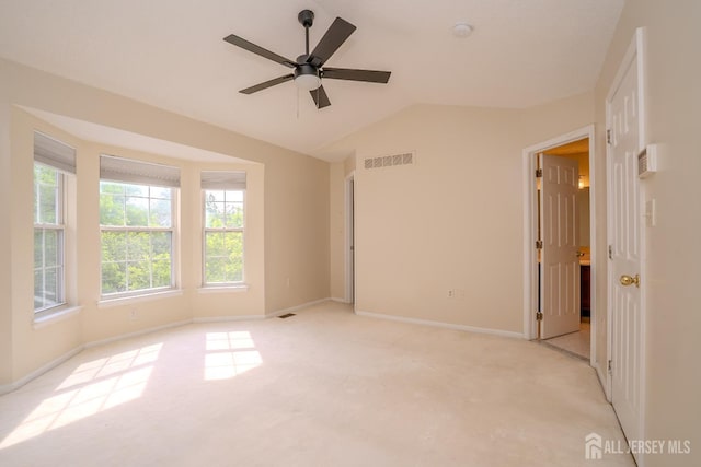 85 W Shrewsbury Pl, Princeton, NJ 08540 - empty room featuring light carpet, healthy amount of natural light, lofted ceiling, baseboards, and a ceiling fan