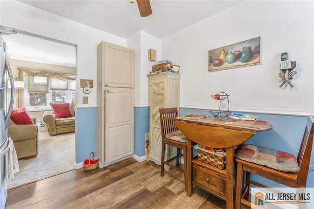 111 E 5th Ave, Port Reading, NJ 07064 - dining room featuring wood finished floors, ceiling fan, and baseboards