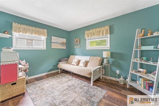 111 E 5th Ave, Port Reading, NJ 07064 - living area featuring baseboards and wood finished floors