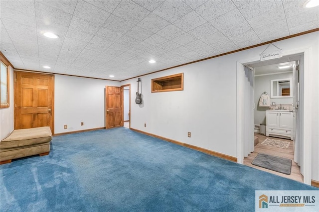 111 E 5th Ave, Port Reading, NJ 07064 - finished below grade area featuring ornamental molding, recessed lighting, baseboards, carpet flooring, and a sink