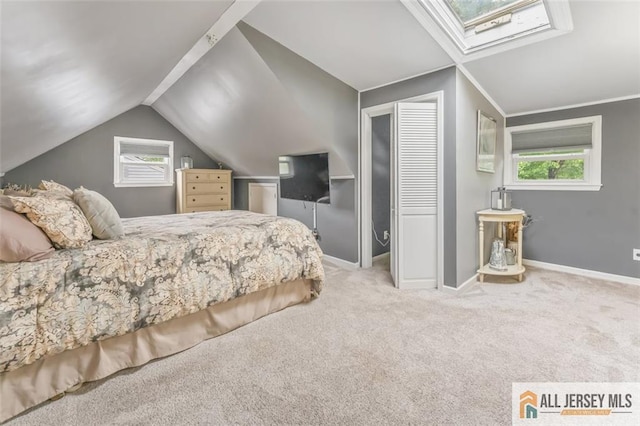 111 E 5th Ave, Port Reading, NJ 07064 - bedroom featuring a skylight, vaulted ceiling, carpet flooring, and baseboards