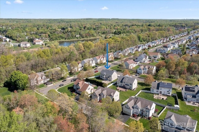 aerial view with a residential view and a view of trees