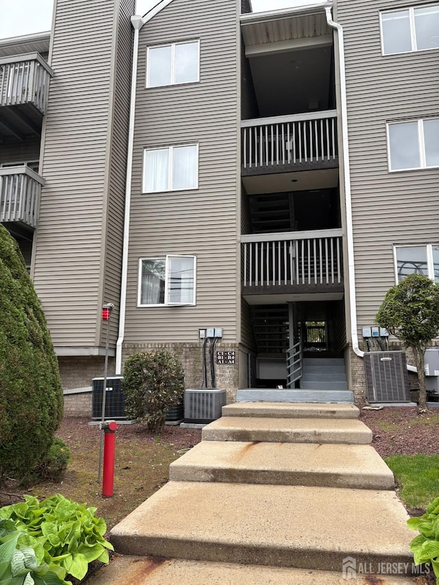 view of building exterior featuring central air condition unit
