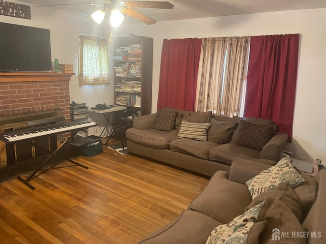 131 Berkeley Ter, Plainfield, NJ 07062 - living room featuring wood finished floors, ceiling fan, and a fireplace