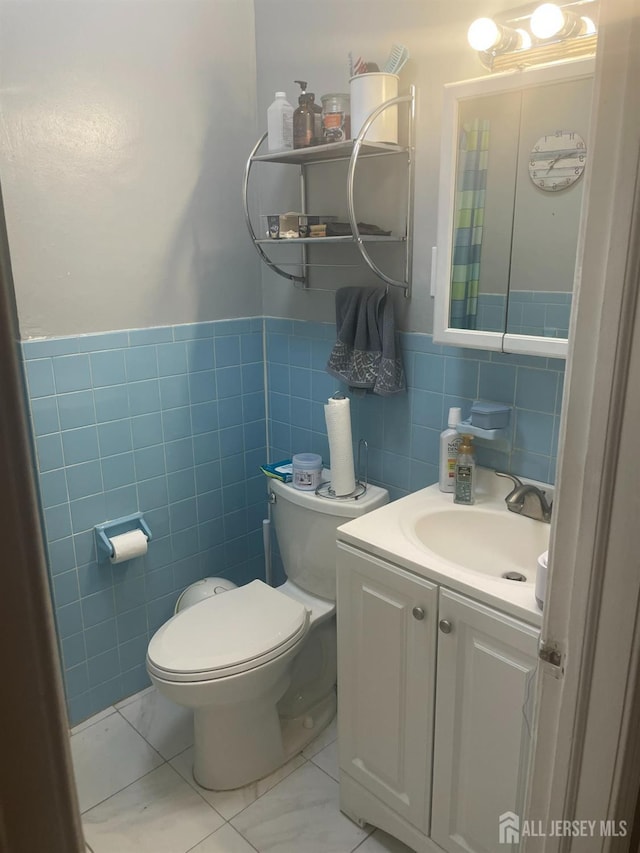 131 Berkeley Ter, Plainfield, NJ 07062 - bathroom with tile walls, vanity, and wainscoting