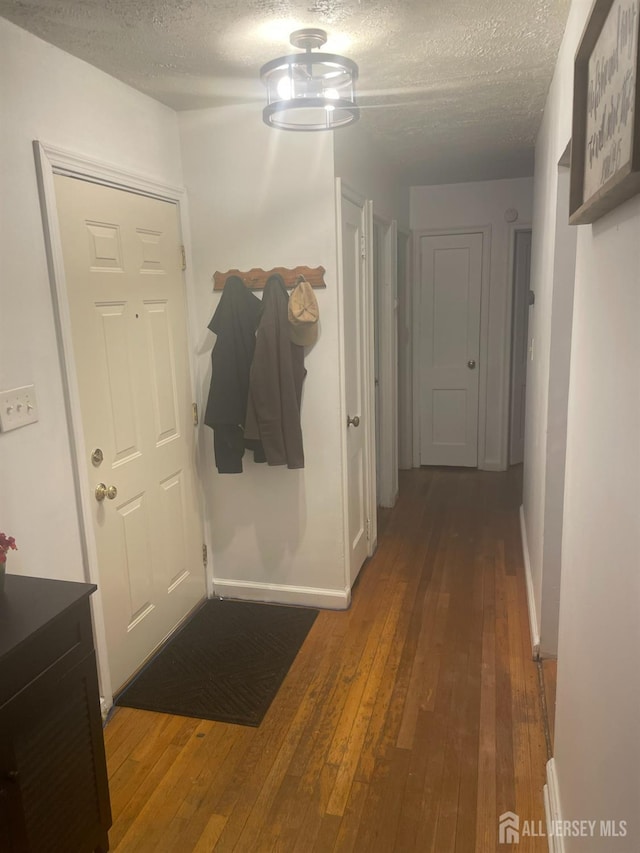 131 Berkeley Ter, Plainfield, NJ 07062 - corridor with hardwood / wood-style floors and a textured ceiling