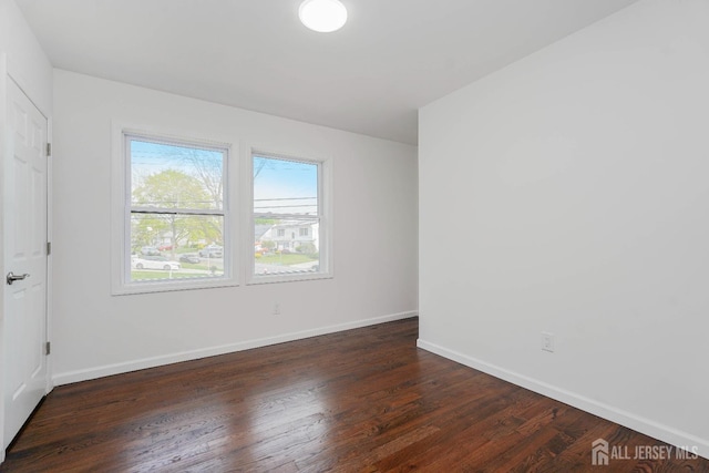 2 Buttonwood Dr, Parlin, NJ 08859 - unfurnished bedroom featuring wood finished floors and baseboards