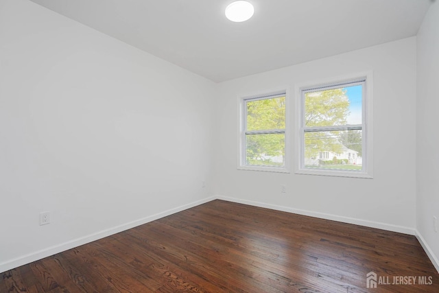 2 Buttonwood Dr, Parlin, NJ 08859 - unfurnished room with baseboards and wood finished floors