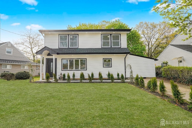 2 Buttonwood Dr, Parlin, NJ 08859 - view of front of home with a front lawn and a shingled roof