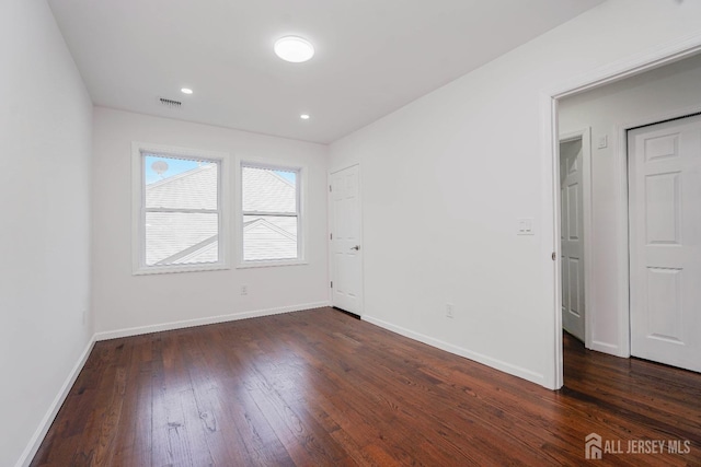 2 Buttonwood Dr, Parlin, NJ 08859 - empty room with dark wood-style floors, baseboards, and recessed lighting