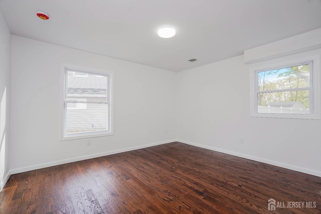 2 Buttonwood Dr, Parlin, NJ 08859 - unfurnished room featuring baseboards and dark wood-style floors