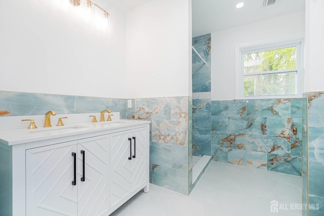2 Buttonwood Dr, Parlin, NJ 08859 - bathroom with a walk in shower, tile walls, a wainscoted wall, and double vanity