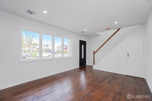 2 Buttonwood Dr, Parlin, NJ 08859 - unfurnished living room featuring wood finished floors, stairs, baseboards, and recessed lighting