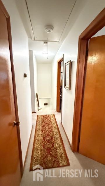 hallway featuring attic access