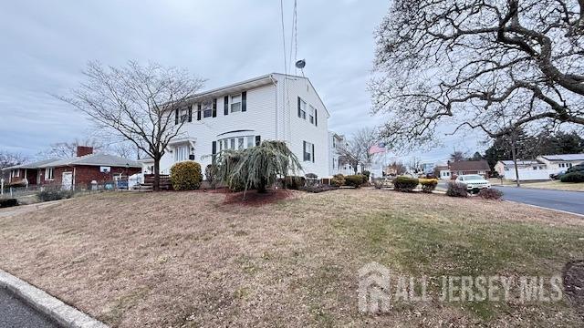 view of home's exterior featuring a yard