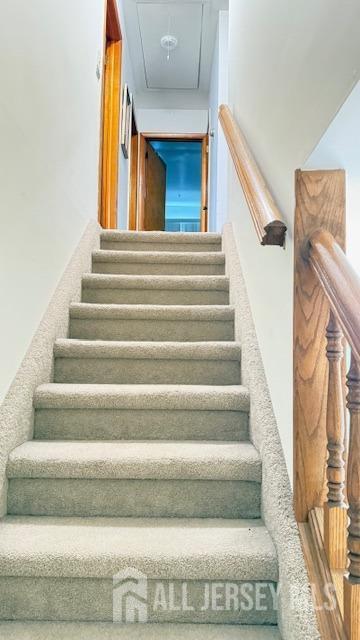 staircase with attic access