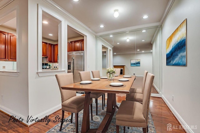 78 Central Ave Unit 49, Metuchen, NJ 08840 - dining room with baseboards, wood finished floors, and crown molding