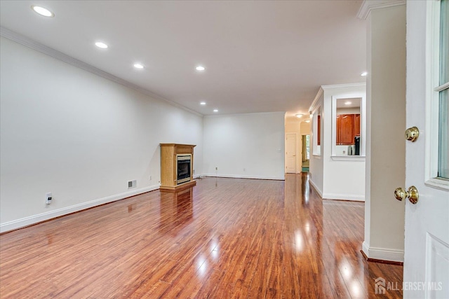 78 Central Ave Unit 49, Metuchen, NJ 08840 - unfurnished living room with ornamental molding, wood finished floors, recessed lighting, baseboards, and a glass covered fireplace