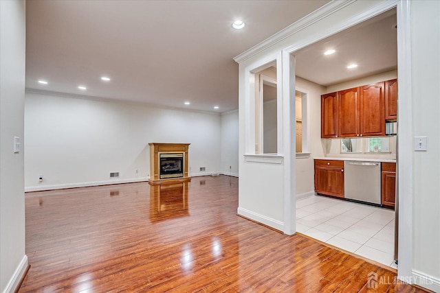 78 Central Ave Unit 49, Metuchen, NJ 08840 - unfurnished living room featuring light wood-type flooring, recessed lighting, ornamental molding, baseboards, and a fireplace