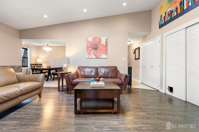 144-C Overlook Ct Unit C, Woodbridge Proper, NJ 07095 - living area featuring wood finished floors, lofted ceiling, recessed lighting, and a chandelier