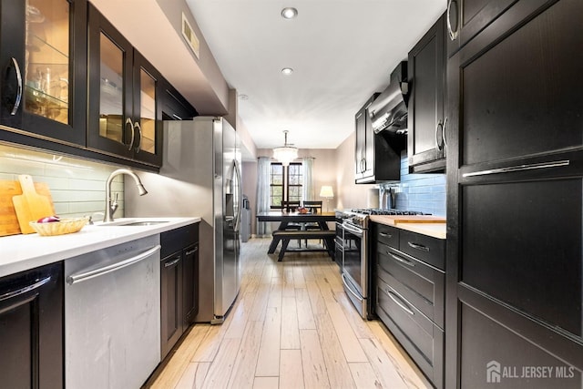 144-C Overlook Ct Unit C, Woodbridge Proper, NJ 07095 - kitchen with appliances with stainless steel finishes, a sink, light countertops, dark cabinets, and recessed lighting