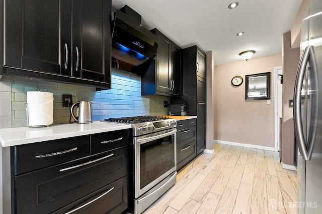 144-C Overlook Ct Unit C, Woodbridge Proper, NJ 07095 - kitchen featuring stainless steel appliances, dark cabinets, extractor fan, baseboards, and recessed lighting