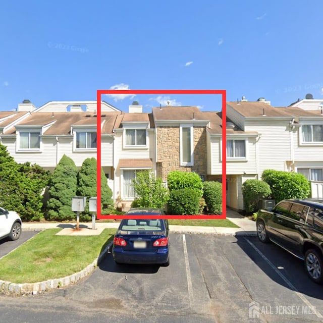 1086 Schmidt Ln, North Brunswick, NJ 08902 - view of property featuring uncovered parking