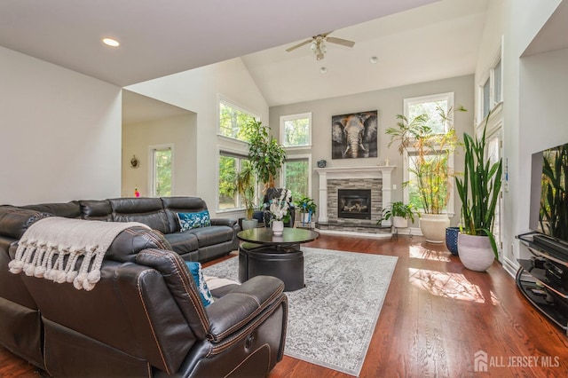 5 Ramapo Ct, Colts Neck, NJ 07722 - living area featuring ceiling fan, healthy amount of natural light, a fireplace, dark wood finished floors, and high vaulted ceiling
