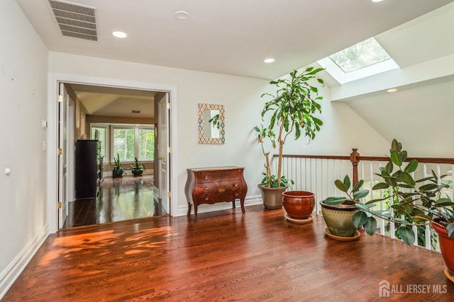 5 Ramapo Ct, Colts Neck, NJ 07722 - sitting room featuring a skylight, wood finished floors, vaulted ceiling, and recessed lighting