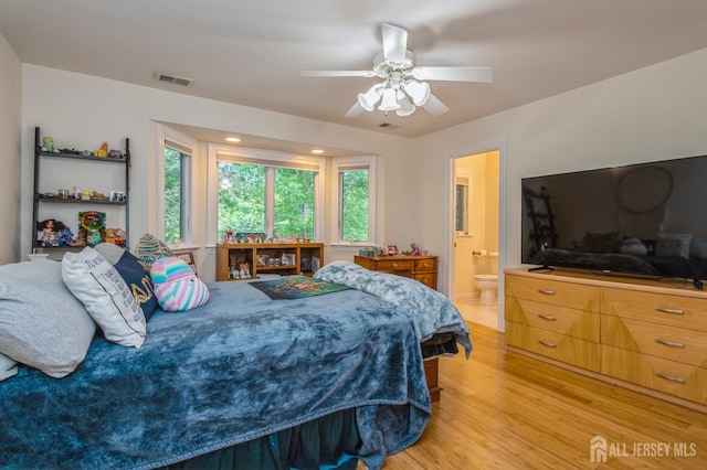 5 Ramapo Ct, Colts Neck, NJ 07722 - bedroom with light wood-style flooring, ensuite bathroom, and ceiling fan