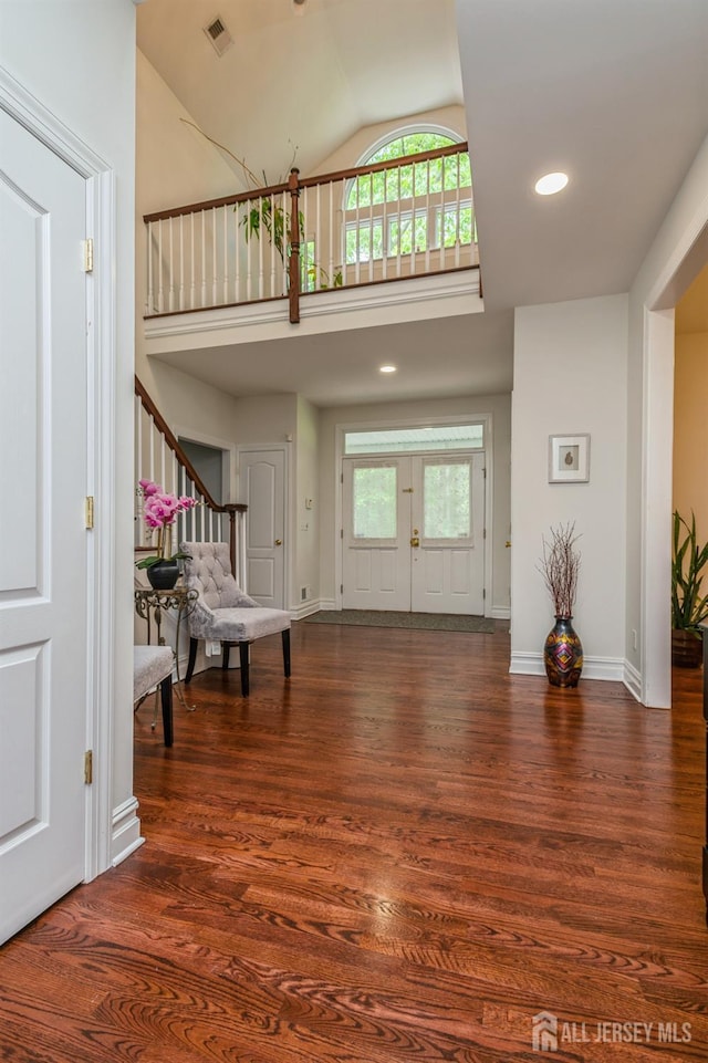 5 Ramapo Ct, Colts Neck, NJ 07722 - foyer featuring plenty of natural light, wood finished floors, high vaulted ceiling, stairs, and recessed lighting