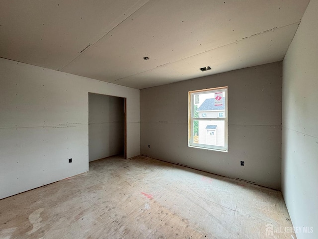 unfurnished bedroom with a closet