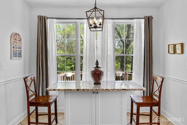 16 Exeter Pass, Colts Neck, NJ 07722 - dining room featuring a chandelier, light tile patterned flooring, and baseboards