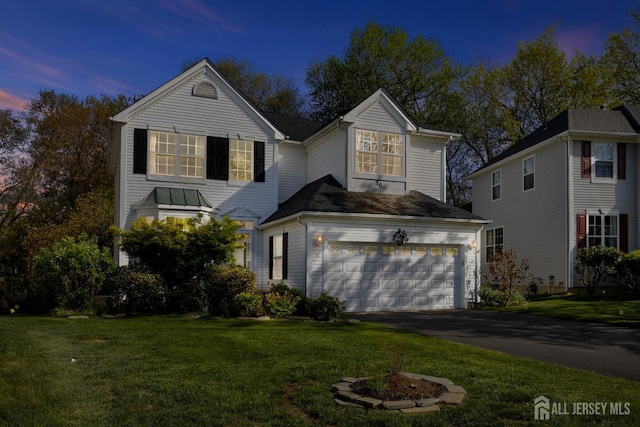 16 Exeter Pass, Colts Neck, NJ 07722 - traditional-style home with driveway, an attached garage, and a lawn